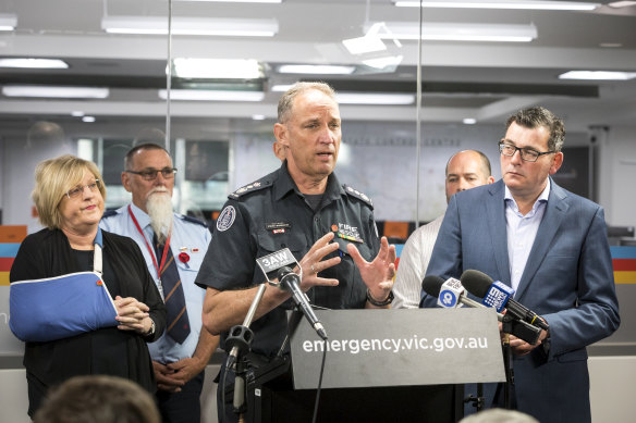 CFA chief officer Steve Warrington flanked by Daniel Andrews and Police Minister Lisa Neville on Sunday.