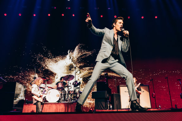 The irrepressible Brandon Flowers, with original members Dave Keuning (left) and Mark Stoermer (right) making a rare overseas appearance. 