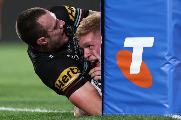 Thomas Flegler starts celebrating after scoring for Brisbane just before half-time.