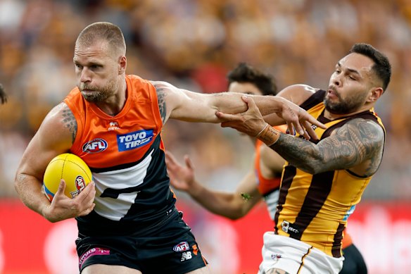Jake Stringer tries to break a Jarman Impey tackle.