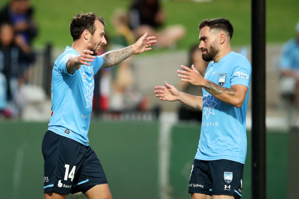 Adam Le Fondre and Anthony Caceres celebrate a Sydney FC goal.