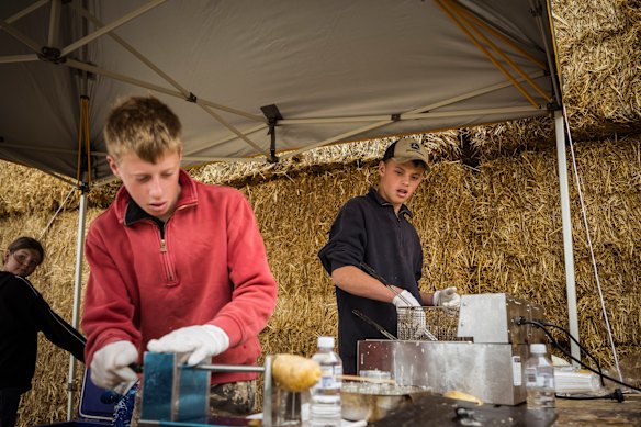 Pitching in: Brothers Jai, left, and Oscar Britt make twisty potatoes to sell to Pick Your Own Potatoes customers.