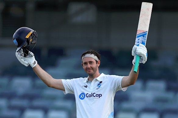 NSW batsman Kurtis Patterson celebrates his century against Western Australia.