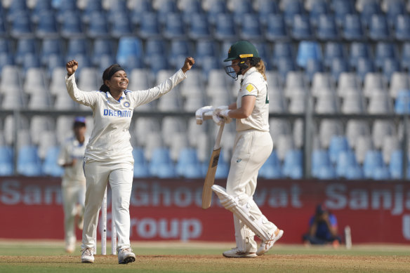 Rajeshwari Gayakwad celebrates the wicket of Jess Jonassen.