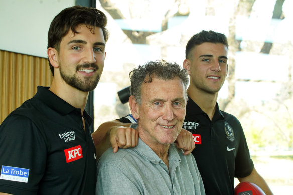 Collingwood’s Josh and Nick Daicos flank their dad – club great, Peter – during grand final week.