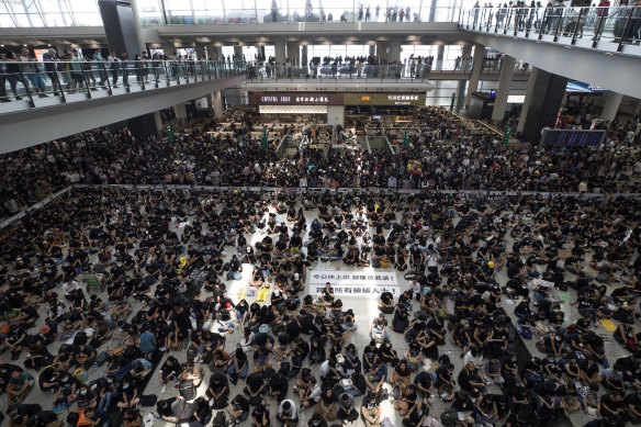 Protesters during a sit-in rally at the arrival hall of the Hong Kong International airport on Monday.