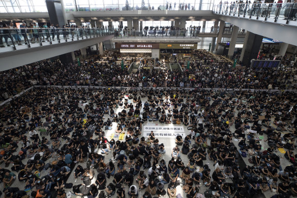 Protesters during a sit-in rally at the arrival hall of the Hong Kong International airport on Monday.