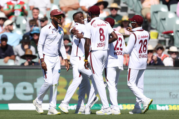 Shamar Joseph celebrates the big wicket of Steve Smith from his first delivery in Test cricket.