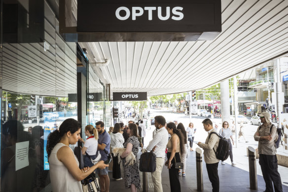Lines outside an Optus store in Melbourne’s Bourke Street Mall on Wednesday.