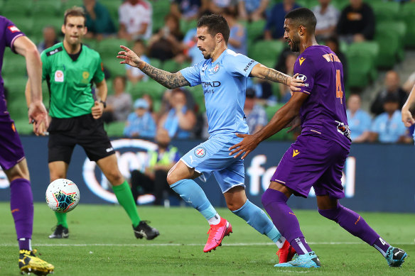 City's Jamie Maclaren looks to get away from Gregory Wuthrich of the Glory.