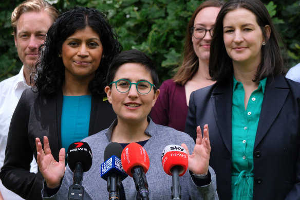 Richmond Greens MP Gabrielle de Vietri (centre) says Victoria needs public housing on public land.
 