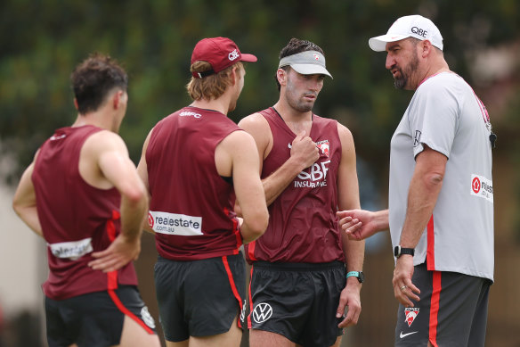 Dean Cox talks to players during Tuesday’s training session.