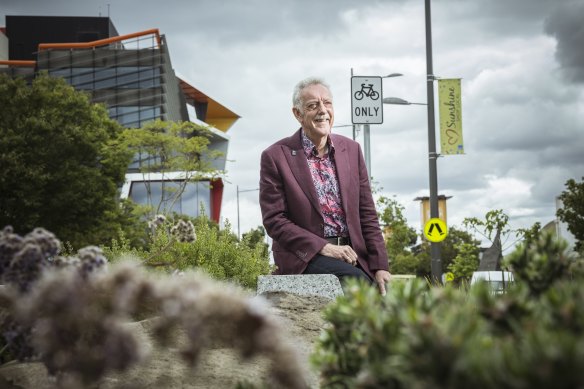 Brimbank Mayor Bruce Lancashire sits on Hampshire Road, with the council offices in the background.