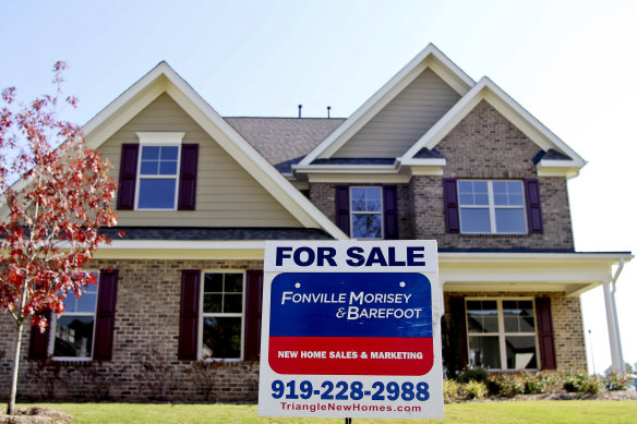 A “For Sale” sign sits outside a home in the US.