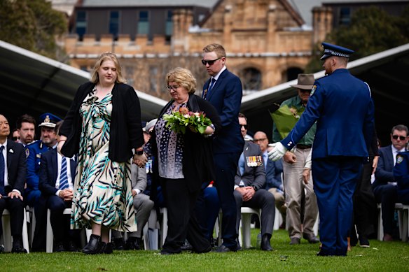 Elizabeth Bransgrove, pictured with son John and daughter Kate after Mark’s death was publicly acknowledged as being caused by his work.
