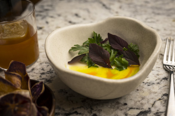 Goat’s cheese custard with purple potato crisps (left).