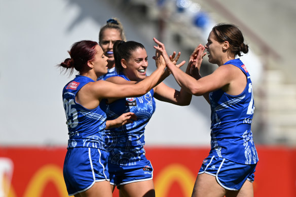 Jasmine Garner celebrates one of her goals in a starring performance for the Kangaroos.