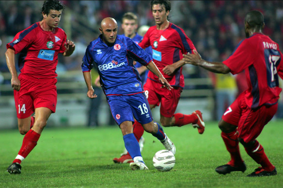 Three Xanthi FC players surround Middlesbrough's Massimo Maccarone during a UEFA Cup match in 2005.