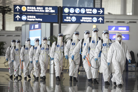 Firefighters prepare to disinfect areas at the Wuhan Tianhe International Airport in April. Wuhan  was the epicentre of the outbreak in China.