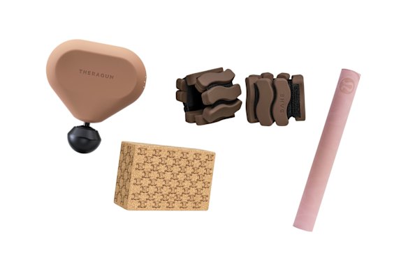 “Theragun Mini” massager; Yoga brick; Wrist and ankle weights; “The Travel Mat” yoga mat.  