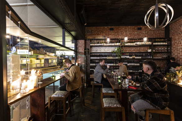 Ruckers Hill wine bar and restaurant in a wine-lined, brick-walled storefront on High Street, Northcote.