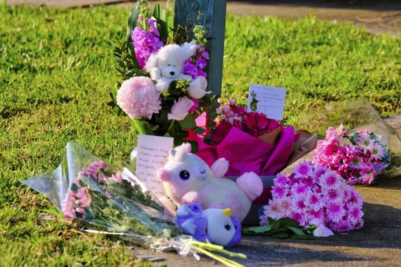 Flowers in front of the Sydenham house where the fire occurred on Thursday.