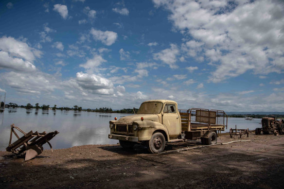 A truck in front of an area affected by floods in the suburb of  Wilberforce.