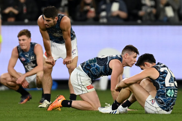 Dejected: Sam Walsh could have been paid a free kick in the final seconds.