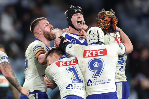 Feeling the love: Bulldogs players celebrate a golden point win over Cronulla.