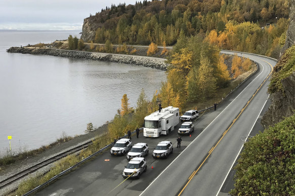 Anchorage police investigate the scene where human remains were found on the Seward Highway in Alaska. 