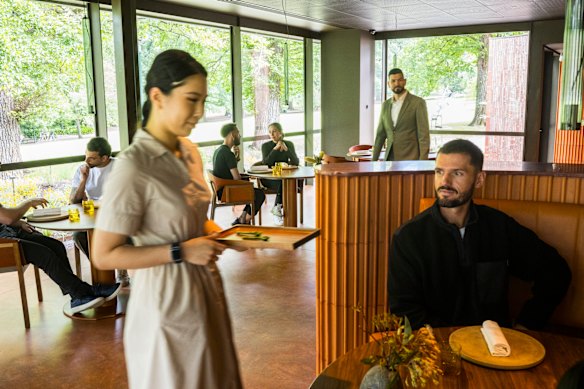 The dining room is surrounded by garden.