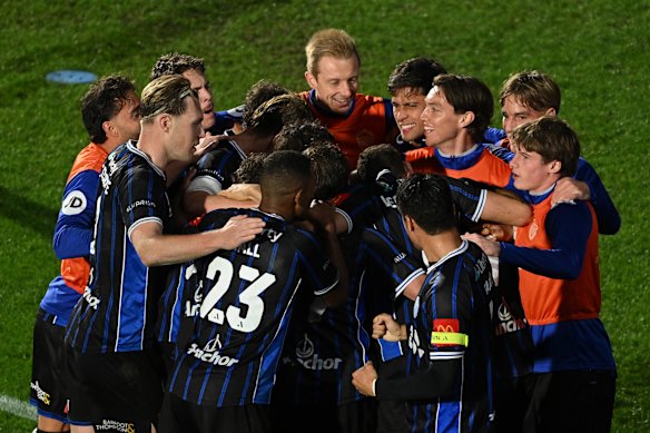 Auckland FC players celebrate Howieson’s goal.