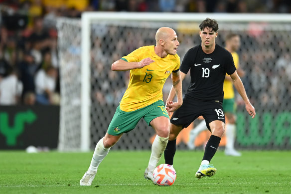 Australia’s Aaron Mooy looks to advance the ball in last year’s centenary match against New Zealand in Brisbane.