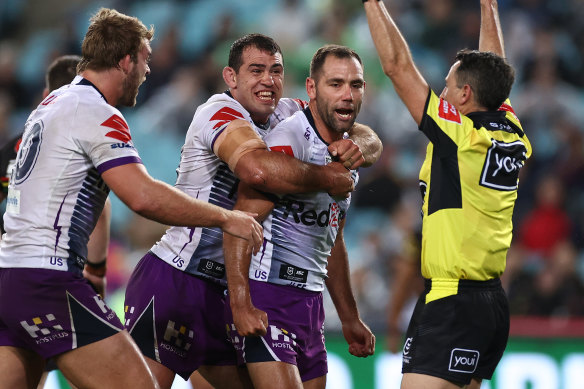 Cameron Smith celebrates during the Storm's 26-20 grand final win over Penrith.