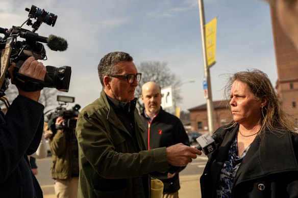 Tracy Vallerand, the victim’s biological mother, speaks to reporters. 