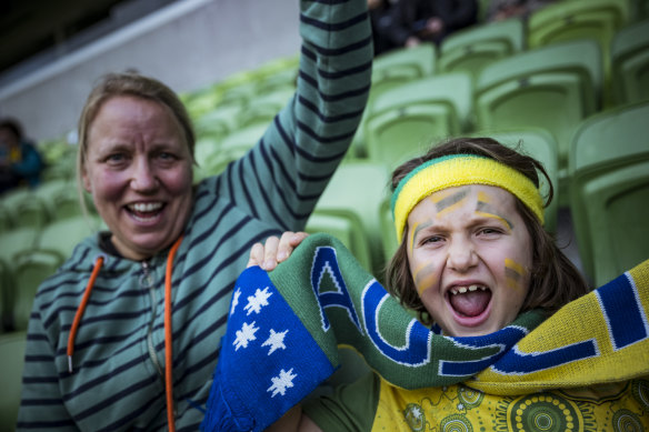 Lenny Daymond, 8, and his mum Claudia watched the Matildas play Sweden at the AAMI Park live site. 