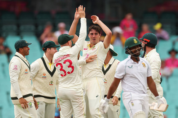 Pat Cummins celebrates getting the wicket of Khaya Zondo.