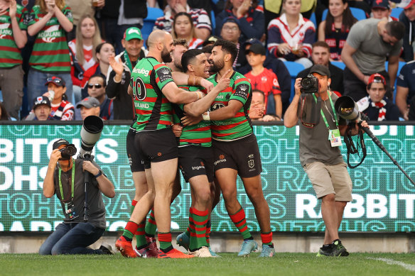 The Rabbitohs celebrate one of Alex Johnston’s two tries at Allianz Stadium.