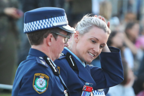 Police officer Amy Scott arrives for a community candlelight vigil at Bondi Beach.