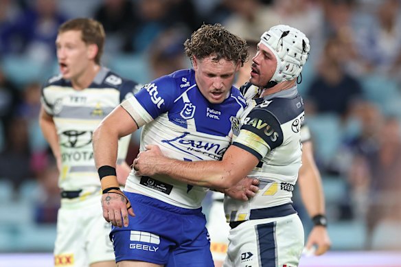 Mahoney comes to the aid of Bulldogs utility Kurt Mann after he sustained a nasty head knock in a collision with Cowboys forward Matt Lodge.