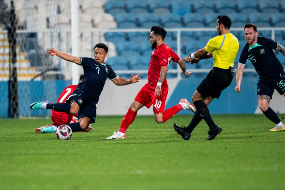 Australia’s Samuel Silvera (left) goes in for a tackle during the friendly against Bahrain.