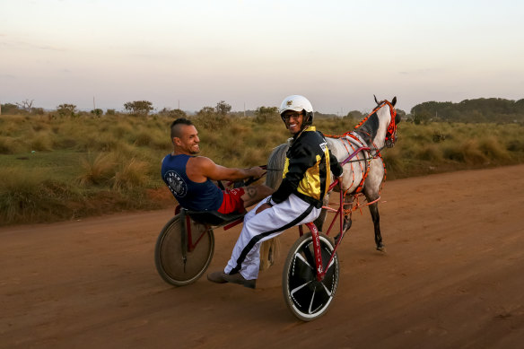 UFC star Charles Oliveira, right, is a massive harness racing fan and drives trotters in his home country, Brazil.
