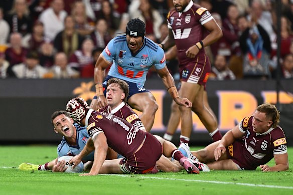Nathan Cleary of the Blues celebrates scoring a try during game three of State of Origin at Suncorp Stadium.