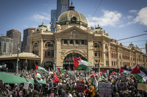 Pro-Palestine protesters outside Flinders Street Station in Melbourne on Sunday.