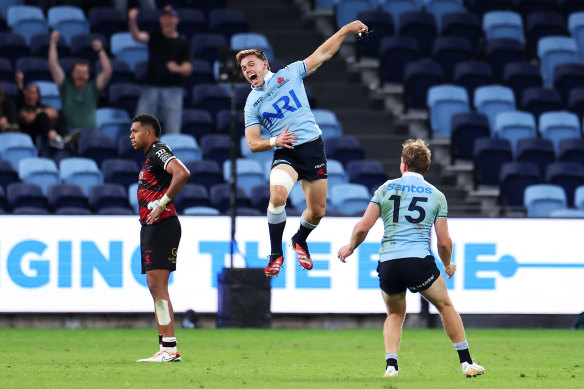 Will Harrison celebrates his match-winning kick. 