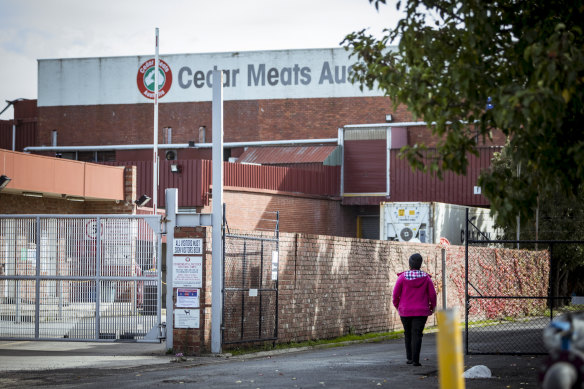 A worker enters the meatworks on Old Geelong Road.