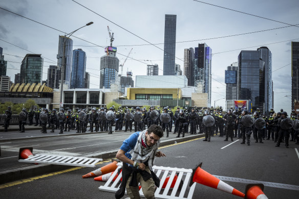 Police shoot a protester with rubber bullets. 