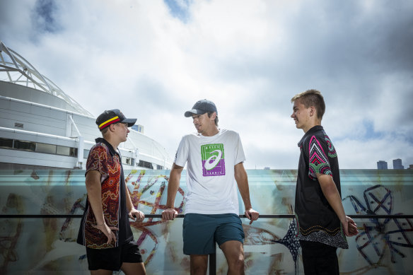 New World Vision Australia ambassador Alex de Minaur chats to brothers Matthew ‘Mouse’ Bates, 15 (left) and Luc Bates, 17, who are part of World Vision’s Young Mob program. 