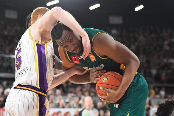 MiKyle McIntosh is manhandled by the Sydney defence.