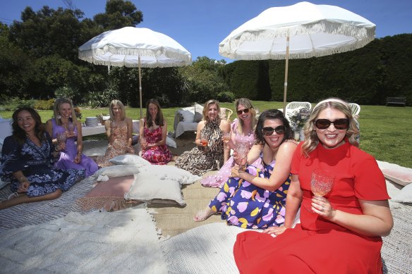 Middle Park mums Paula Barbosa (front left) and Lizzie Bosak (right) with their friends dressed up and celebrated Melbourne Cup day in St Kilda Gardens.
